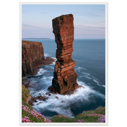 Red sandstone sea stack at last light above an Atlantic cliff coast, print in a white frame