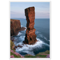 Red sandstone sea stack at last light above an Atlantic cliff coast, print in a white frame