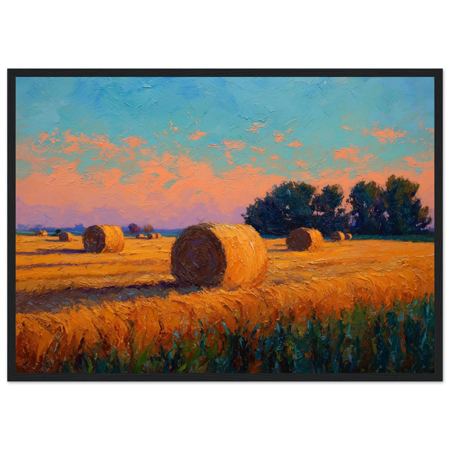 Harvest field and bales under an evening sky, print in a dark frame