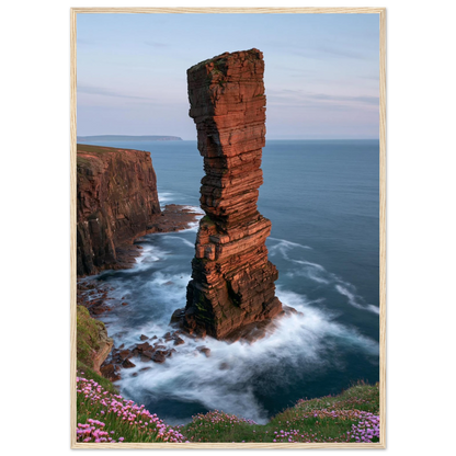 Red sandstone sea stack at last light above an Atlantic cliff coast, print in a natural light wood frame