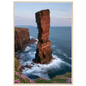 Red sandstone sea stack at last light above an Atlantic cliff coast, print in a natural light wood frame