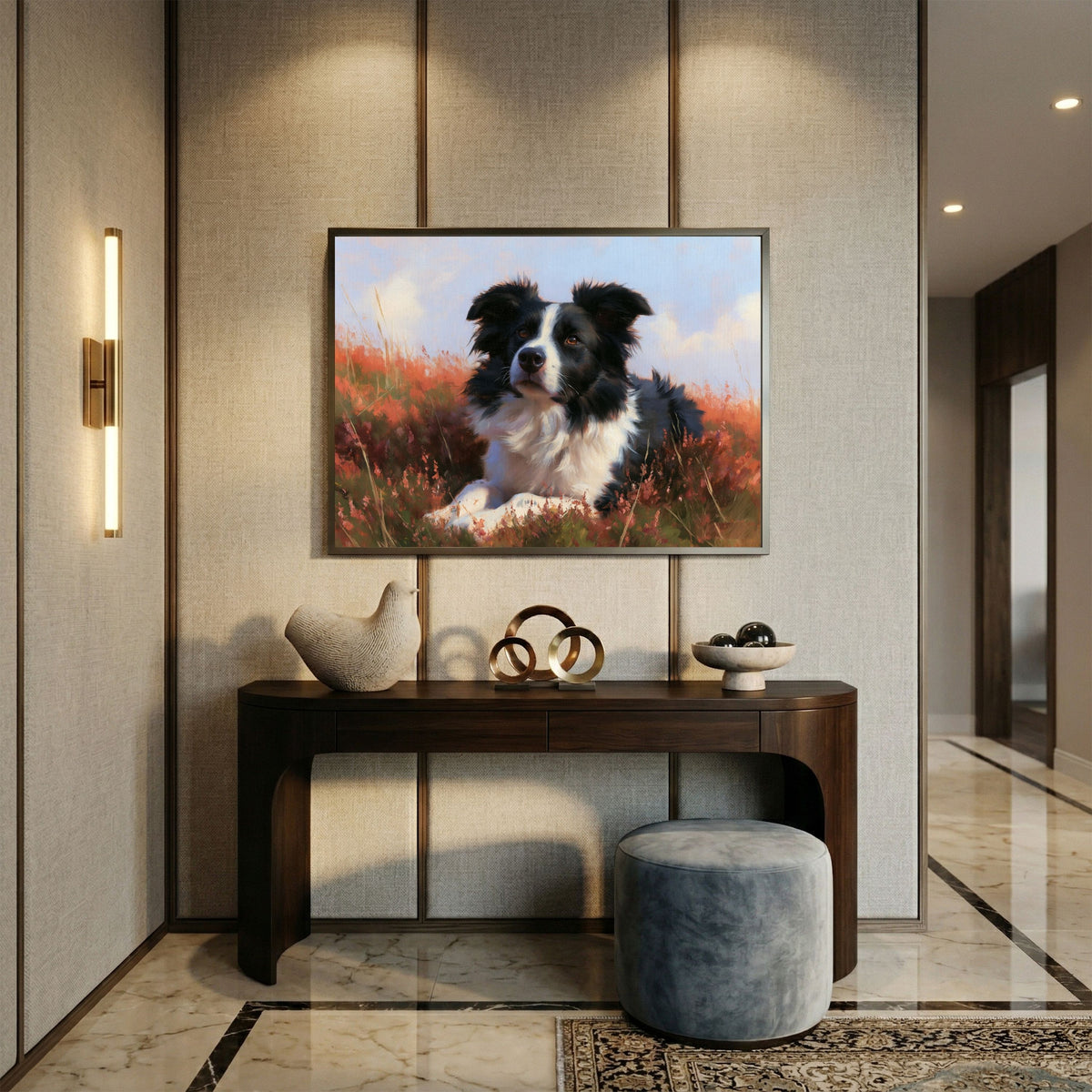 Border collie lying in flowering heather, in a dark frame above a console table in a marble-floored hallway