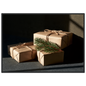 Kraft paper parcels tied with jute twine and spruce, print in a black frame