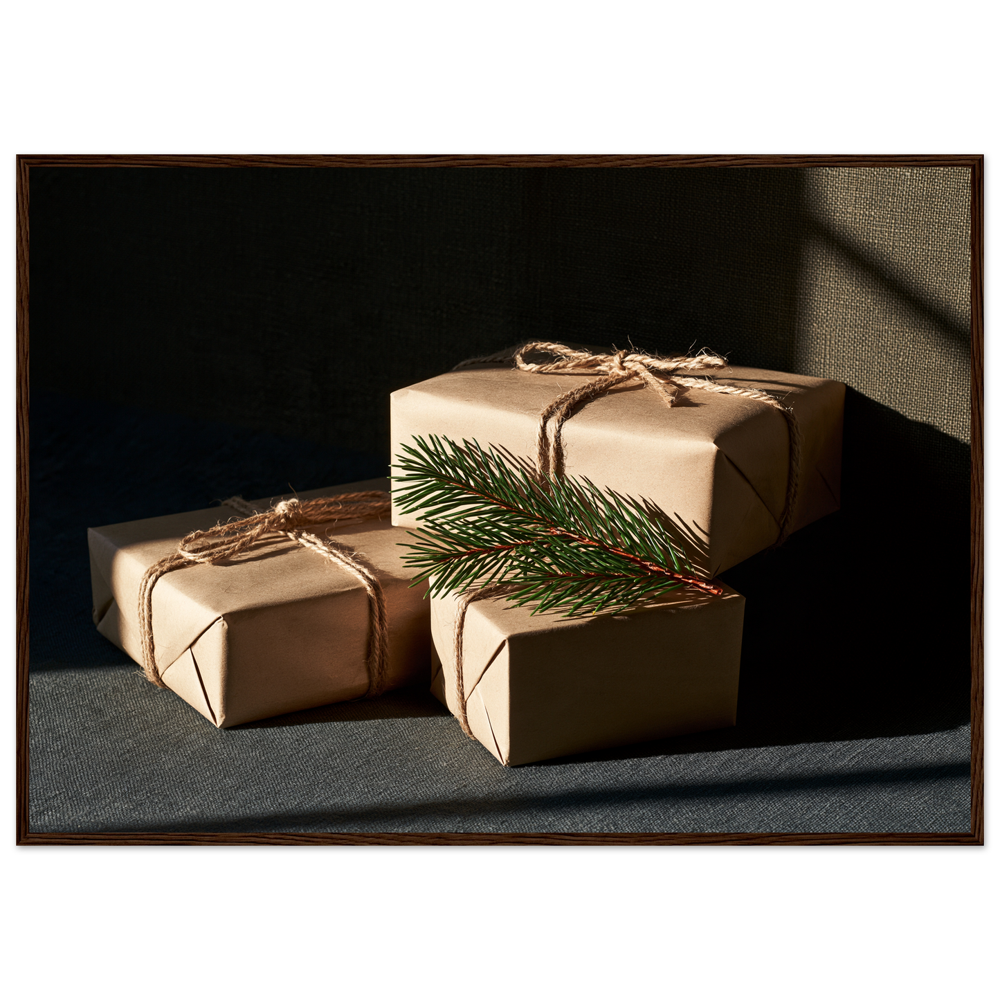 Kraft paper parcels tied with jute twine and spruce, print in a dark wood frame