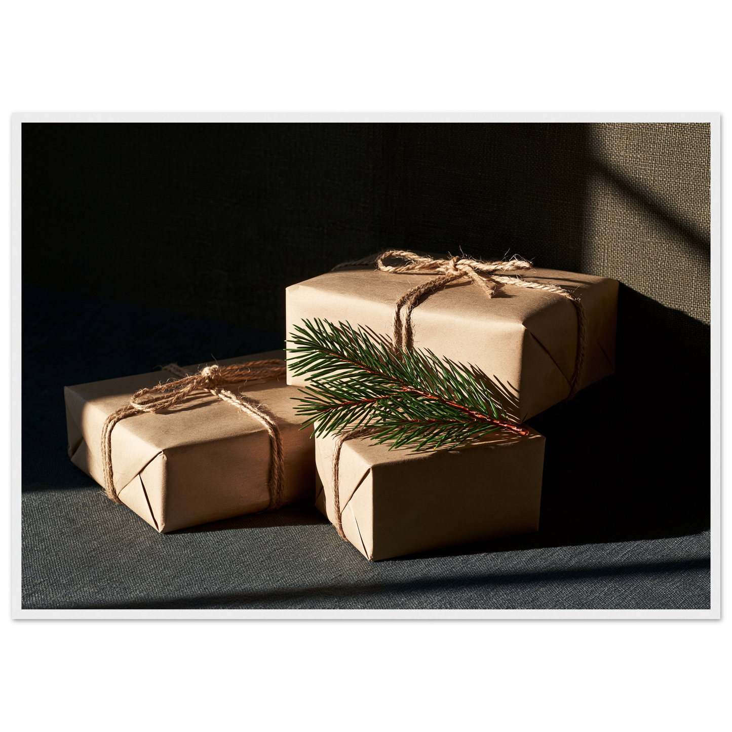 Kraft paper parcels tied with jute twine and spruce, print in a white frame