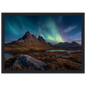 Mirrie Dancers over a dark Highland peak, framed in charcoal