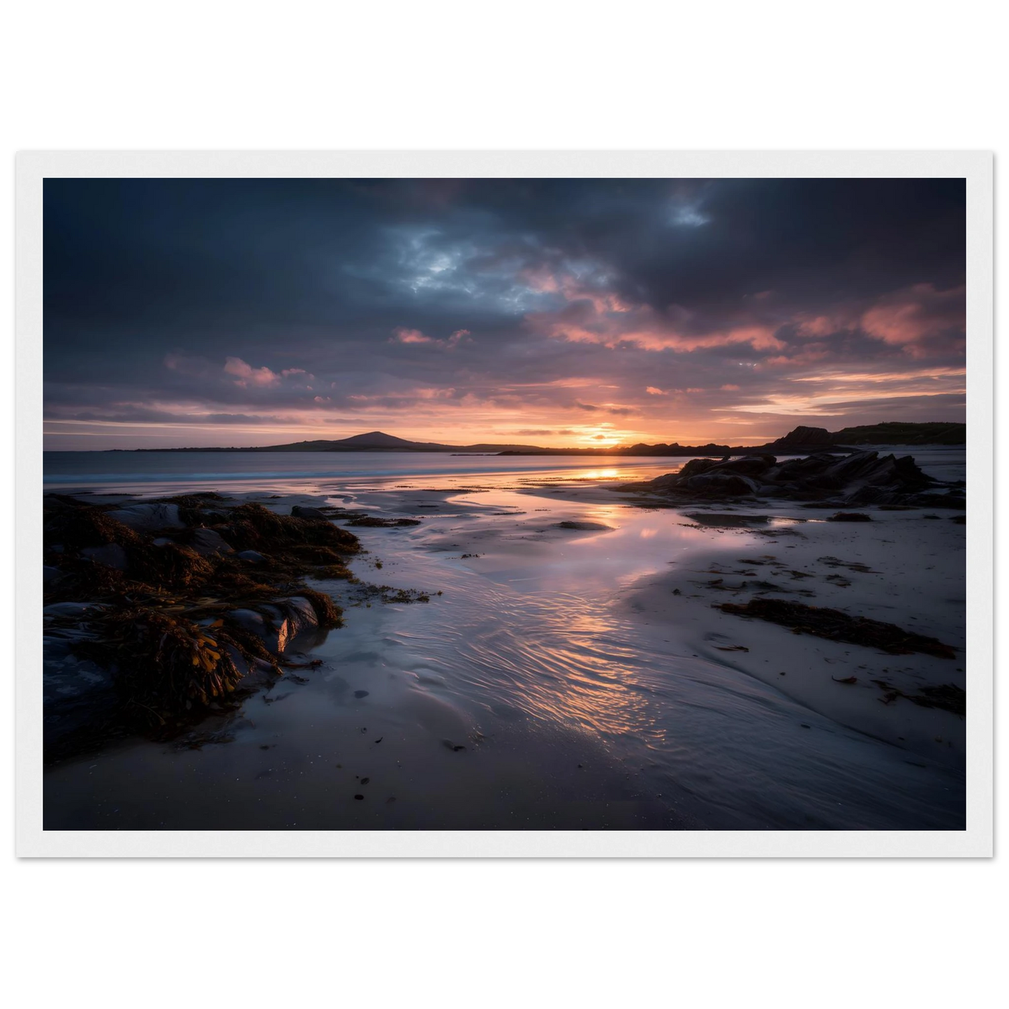 Moody beach sunset print in a white frame