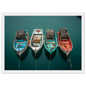 Overhead harbour scene with four coloured hulls, framed in white with a wide mount