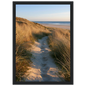 Sand track through amber marram grass to an empty beach at golden hour, print in a black frame