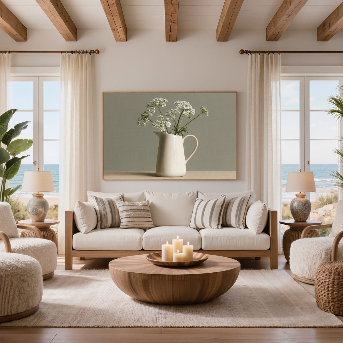 Cow parsley in a cream jug still life, print in a light wood frame above a cream sofa in a beamed coastal living room