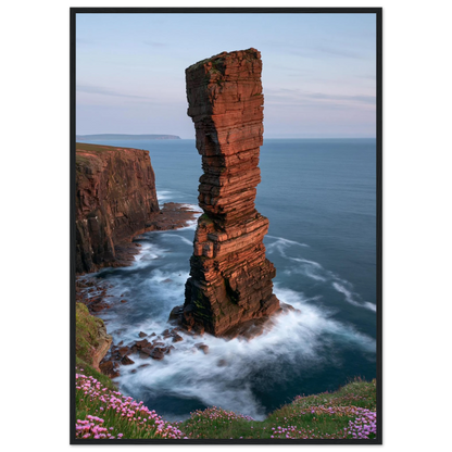 Red sandstone sea stack at last light above an Atlantic cliff coast, print in a black frame