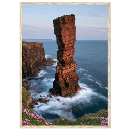 Red sandstone sea stack at last light above an Atlantic cliff coast, print in a natural light wood frame