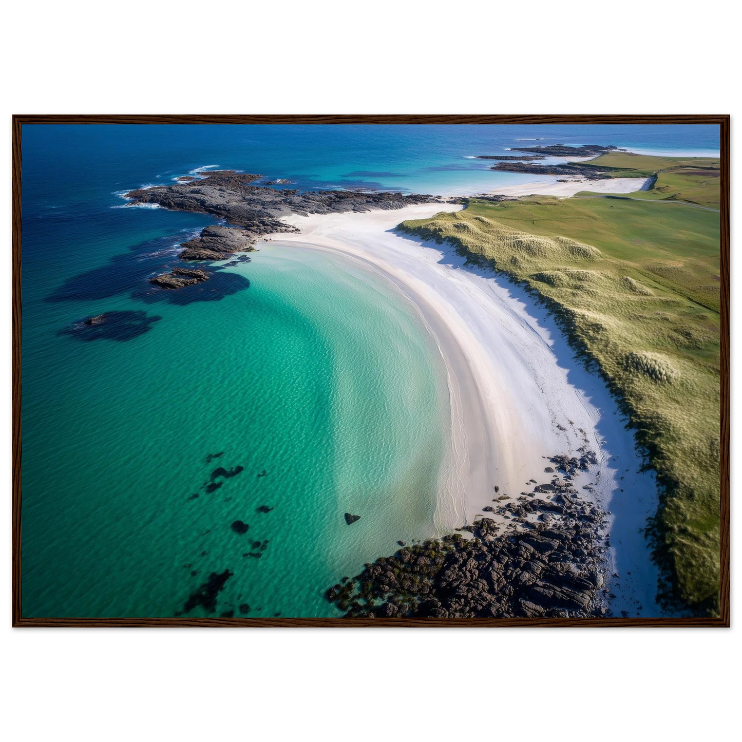 Hebridean beach from above with jade shallows and white sand, framed in dark brown wood