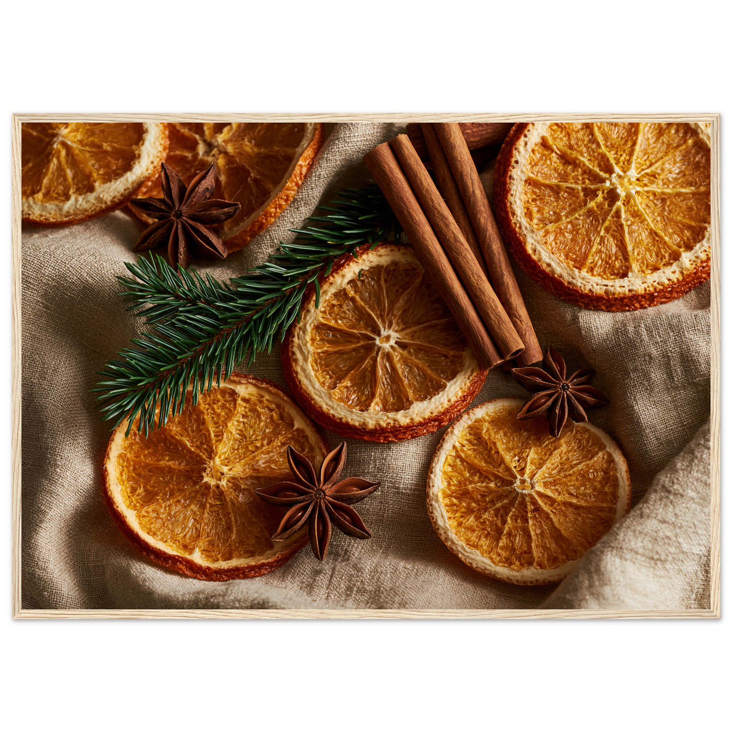 Dried oranges, cinnamon and star anise on linen, print in a natural wood frame