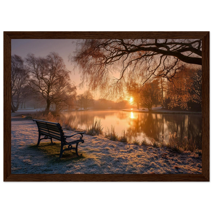 Frosted park lake at winter sunrise with an empty bench on the bank, print in a dark brown wood frame
