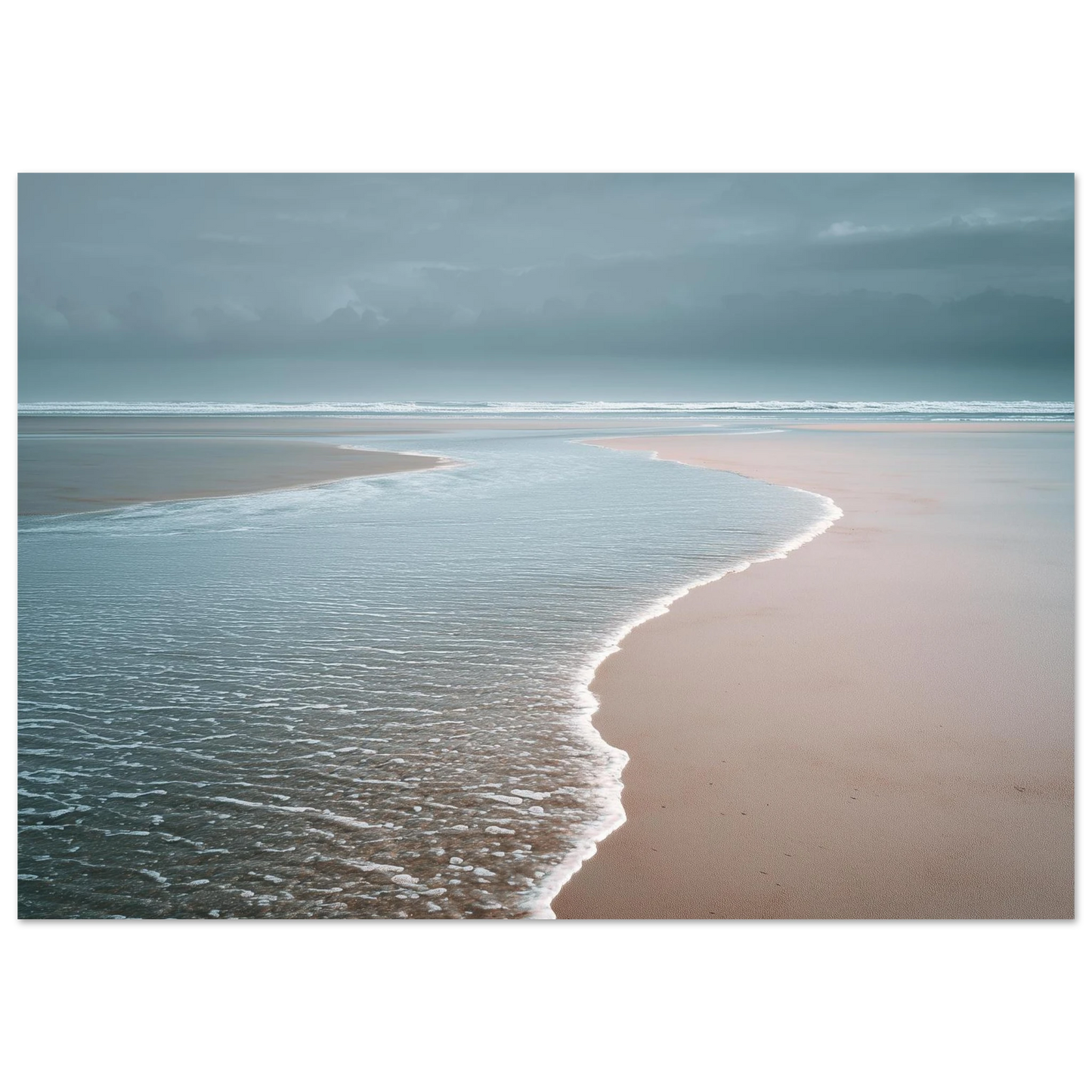 A thin sheet of water sliding back over pale wet sand under a grey sky, minimalist beach scene, print in a slim dark frame