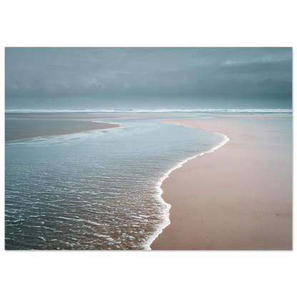 A thin sheet of water sliding back over pale wet sand under a grey sky, minimalist beach scene, print in a slim dark frame