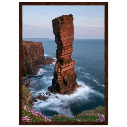 Red sandstone sea stack at last light above an Atlantic cliff coast, print in a dark brown wood frame