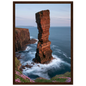 Red sandstone sea stack at last light above an Atlantic cliff coast, print in a dark brown wood frame