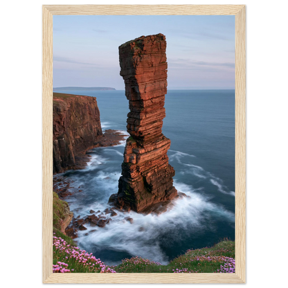 Red sandstone sea stack at last light above an Atlantic cliff coast, print in a natural light wood frame