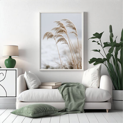 Frosted reeds print in a white frame above a white sofa in a bright living room