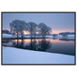 Frosted trees reflected in a frozen lake at first light, print in a black frame