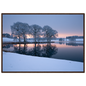 Frosted trees reflected in a frozen lake at first light, print in a dark wood frame