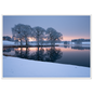 Frosted trees reflected in a frozen lake at first light, print in a white frame