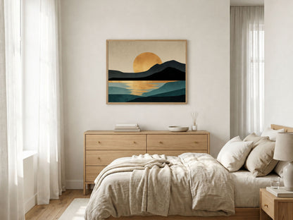 Minimalist gold sun over dark hills and teal water, framed in light wood above a dresser in a sunlit bedroom