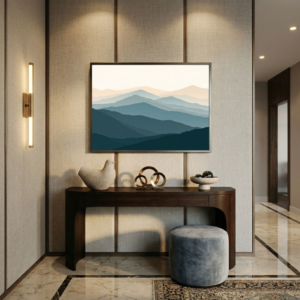 Highland ridgelines in layered flat bands, in a pale wood frame above a console table in a panelled hallway
