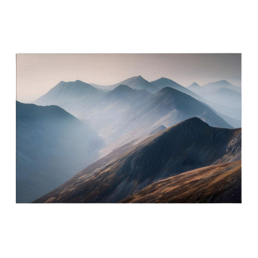 Layered Scottish Highland ridges receding into morning mist, copper bracken on the near slope against pale blue distance, printed on stretched canvas