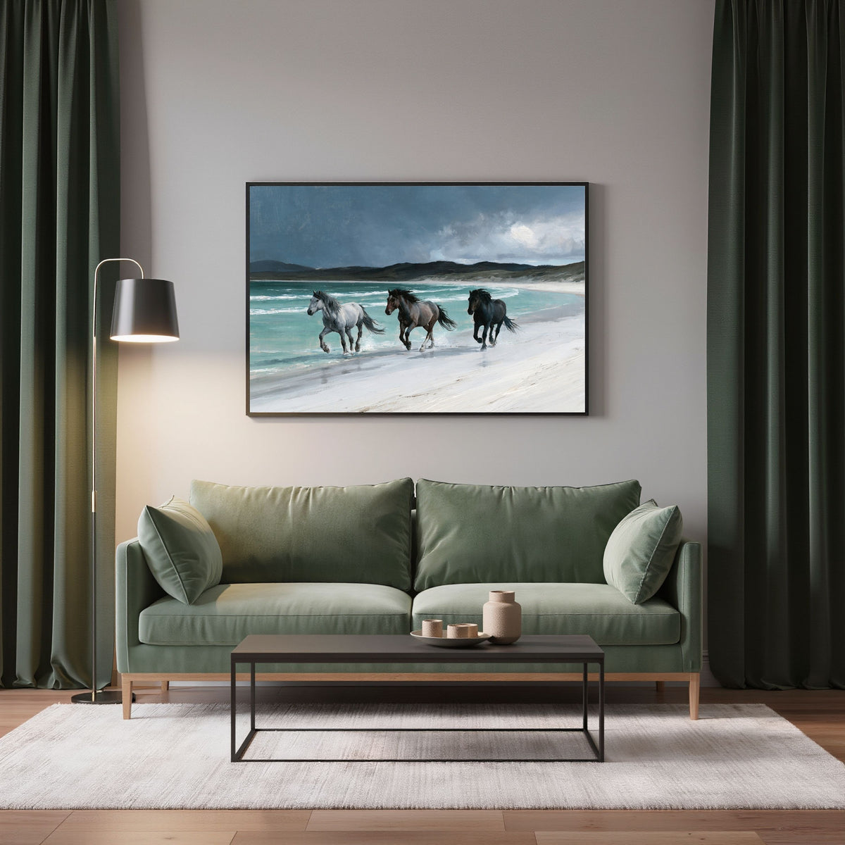 Horses on a Hebridean beach, in a black frame above a sage green sofa between dark green curtains in a living room