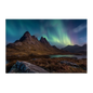 Green and violet northern lights over a dark Highland peak with a still loch below, printed on stretched canvas