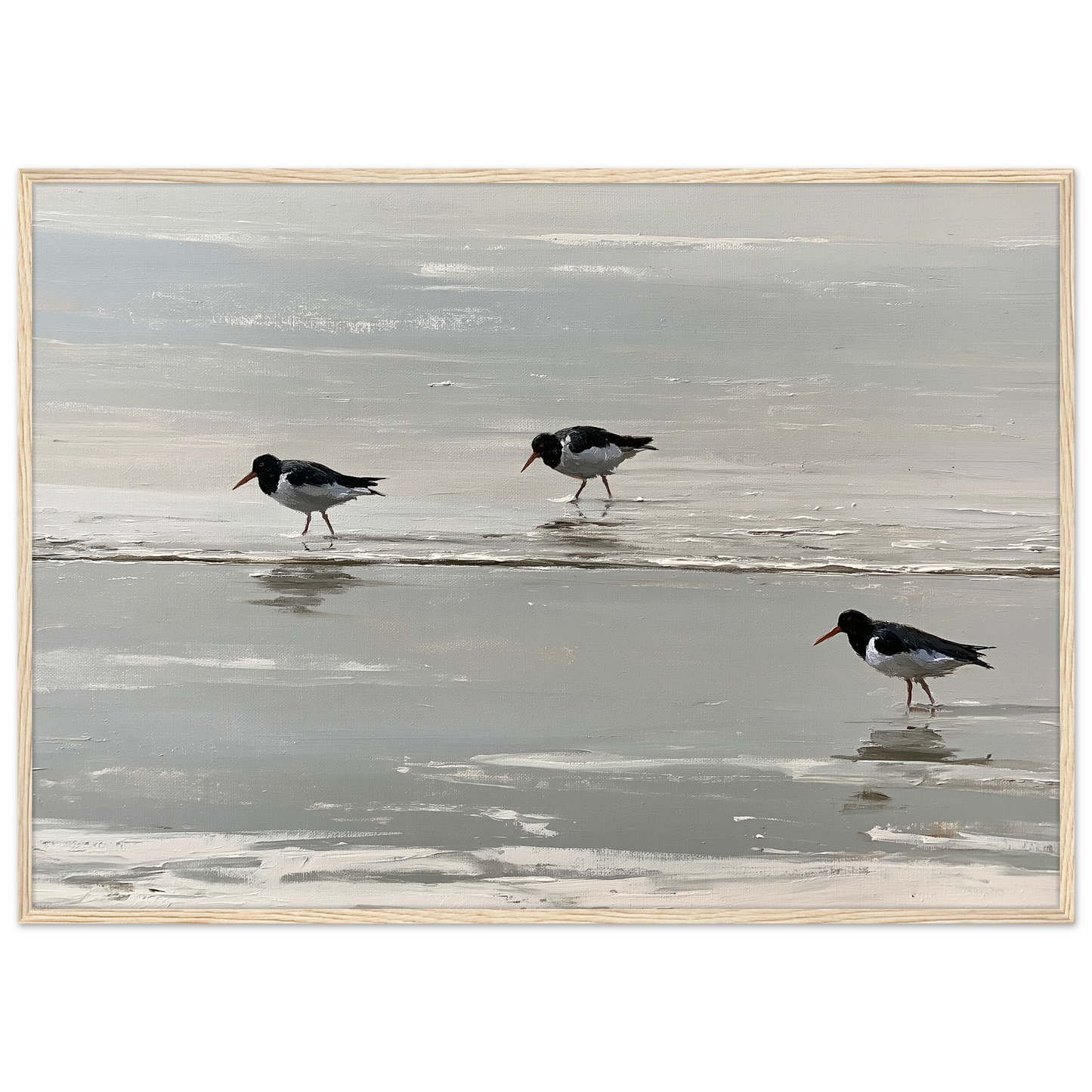 Oystercatchers on the tideline coastal print in a pale natural wood frame