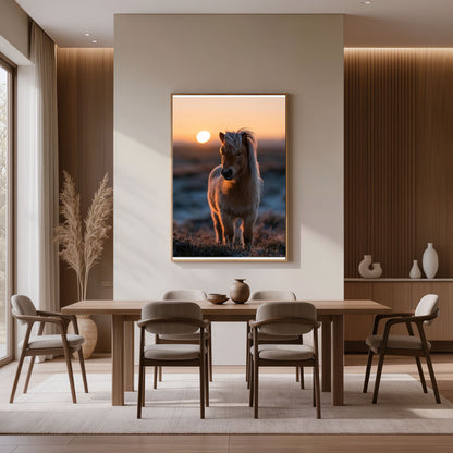 Shetland pony at sunset, in a natural wood frame above a dining table against a timber panelled wall