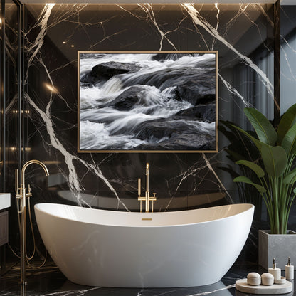 Silk water over dark rock, in a slim gold frame above a freestanding bath against black marble