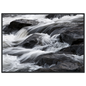 Silk water over dark rock, print in a black frame