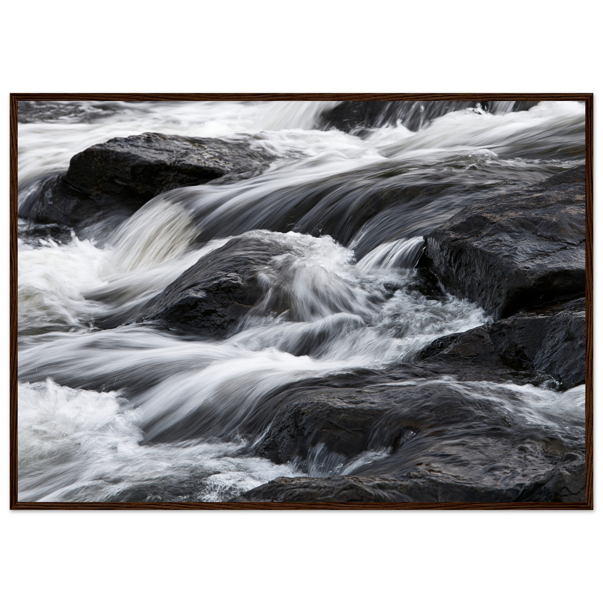 Silk water over dark rock, print in a dark wood frame
