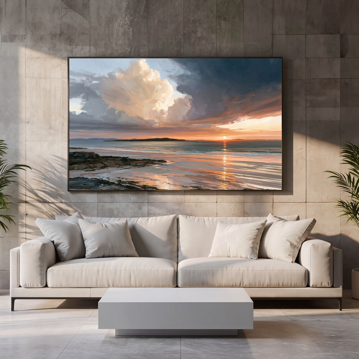 Storm light over the bay, in a black frame on a stone-tiled wall above a cream sofa and a low white coffee table in a living room
