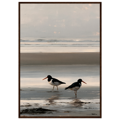 Two oystercatchers at low water coastal print in a dark brown wood frame