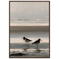 Two oystercatchers at low water coastal print in a dark brown wood frame