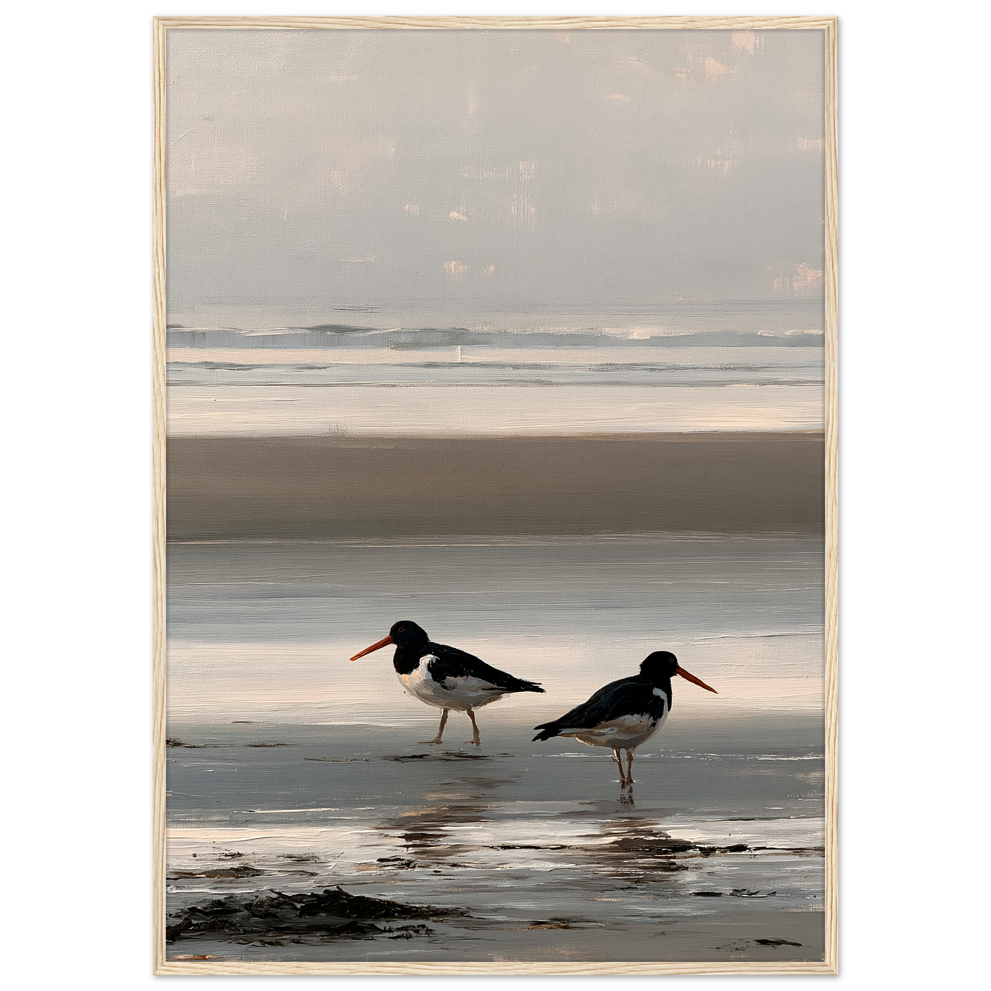 Two oystercatchers at low water coastal print in a pale natural wood frame