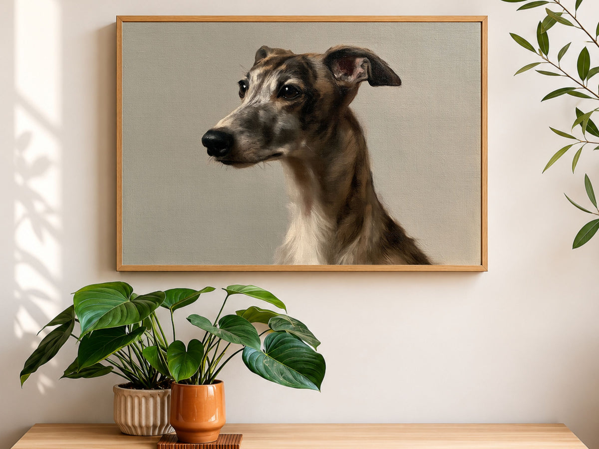 A brindle whippet oil portrait in a wood frame, hanging above a console table with houseplants