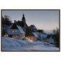 A snow-covered village with lit windows at dusk, print in a dark wood frame