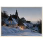 A snow-covered village with lit windows at dusk, print in a natural wood frame